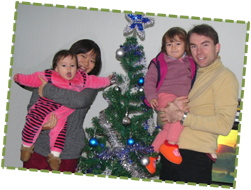 The family in front of our Christmas tree